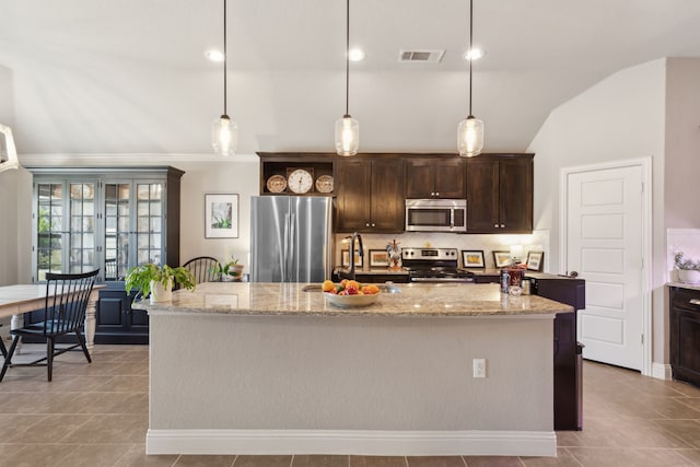 kitchen with tasteful backsplash, visible vents, stainless steel appliances, dark brown cabinets, and a sink