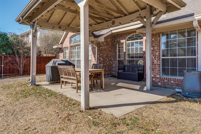 view of patio featuring fence