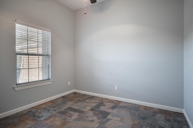 510 Meadow Pond Ct, Runaway Bay, TX 76426 - spare room with stone finish floor, a ceiling fan, and baseboards