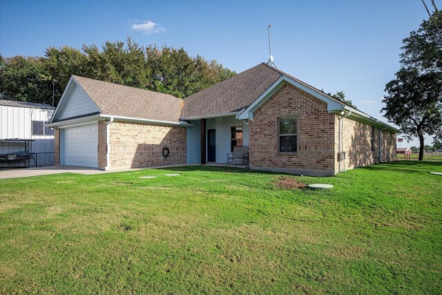 510 Meadow Pond Ct, Runaway Bay, TX 76426 - single story home featuring a garage, brick siding, concrete driveway, and a front yard