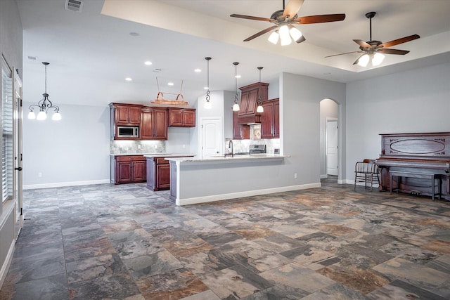 510 Meadow Pond Ct, Runaway Bay, TX 76426 - kitchen featuring a ceiling fan, arched walkways, appliances with stainless steel finishes, light countertops, and baseboards