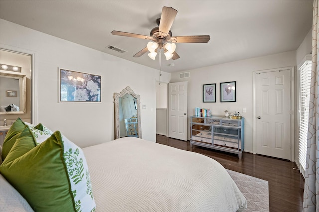 bedroom featuring dark wood-type flooring, visible vents, and a ceiling fan