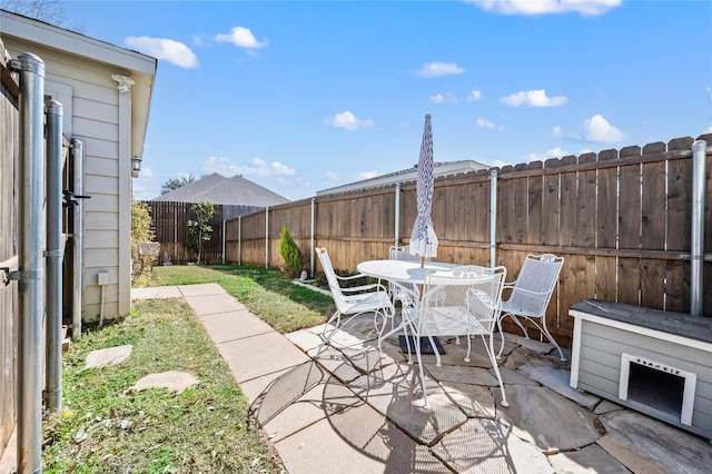 view of patio / terrace with a fenced backyard and outdoor dining area