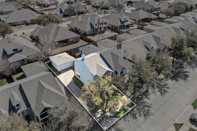 birds eye view of property with a residential view