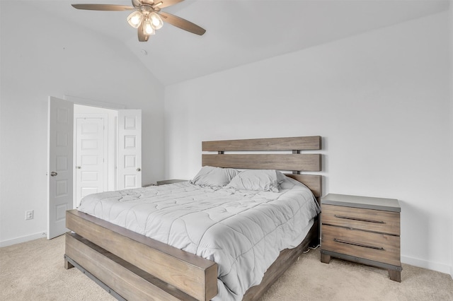 carpeted bedroom with ceiling fan, baseboards, and vaulted ceiling