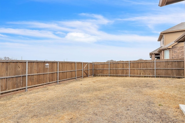 view of yard featuring a fenced backyard