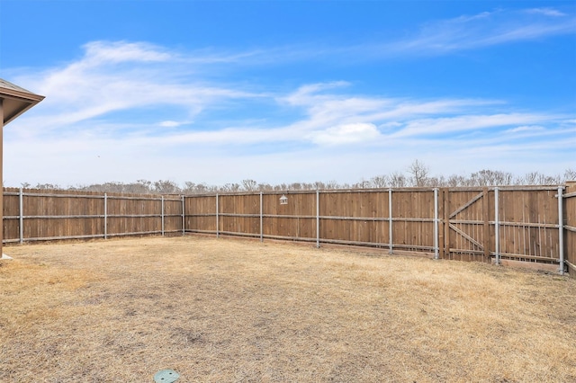 view of yard featuring a fenced backyard