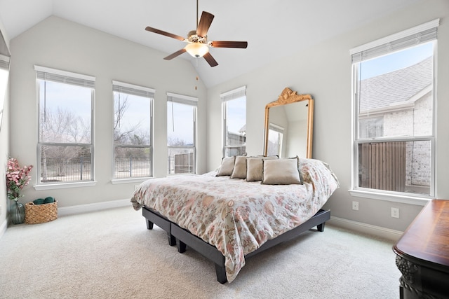 bedroom featuring lofted ceiling, ceiling fan, carpet flooring, and baseboards