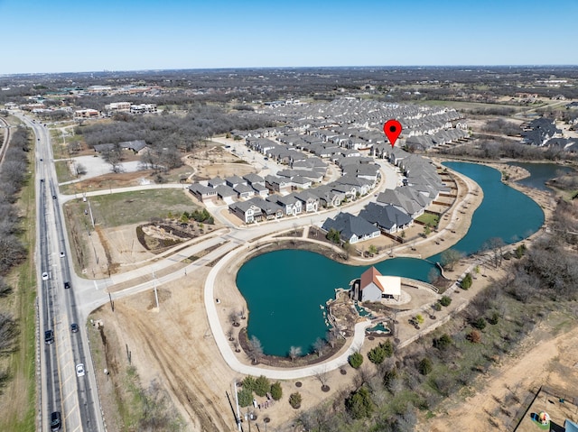 bird's eye view featuring a residential view and a water view