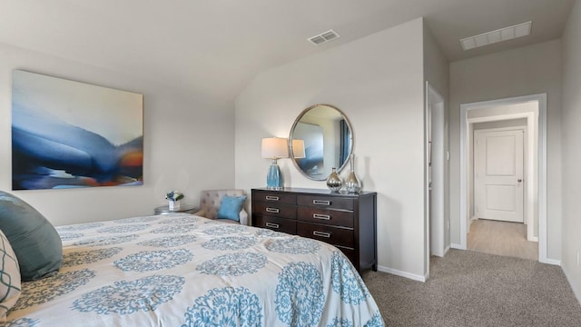 bedroom with carpet, visible vents, and baseboards