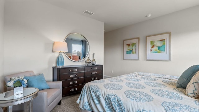 carpeted bedroom with visible vents