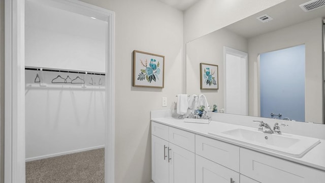 bathroom featuring visible vents and vanity