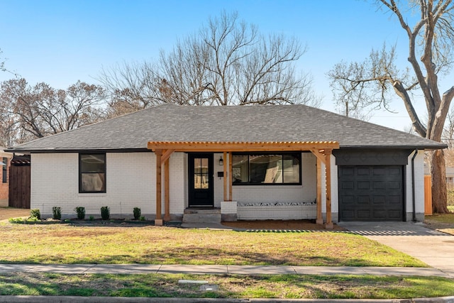 single story home with a garage, driveway, brick siding, and a shingled roof