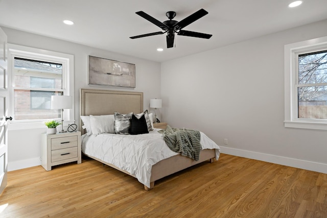 bedroom featuring light wood finished floors, ceiling fan, baseboards, and recessed lighting