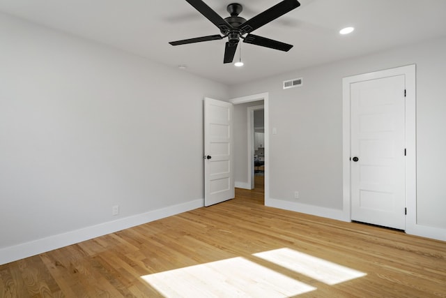 unfurnished bedroom featuring recessed lighting, visible vents, light wood-style flooring, and baseboards