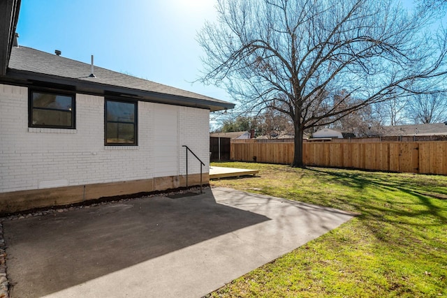 view of yard featuring a patio area and fence