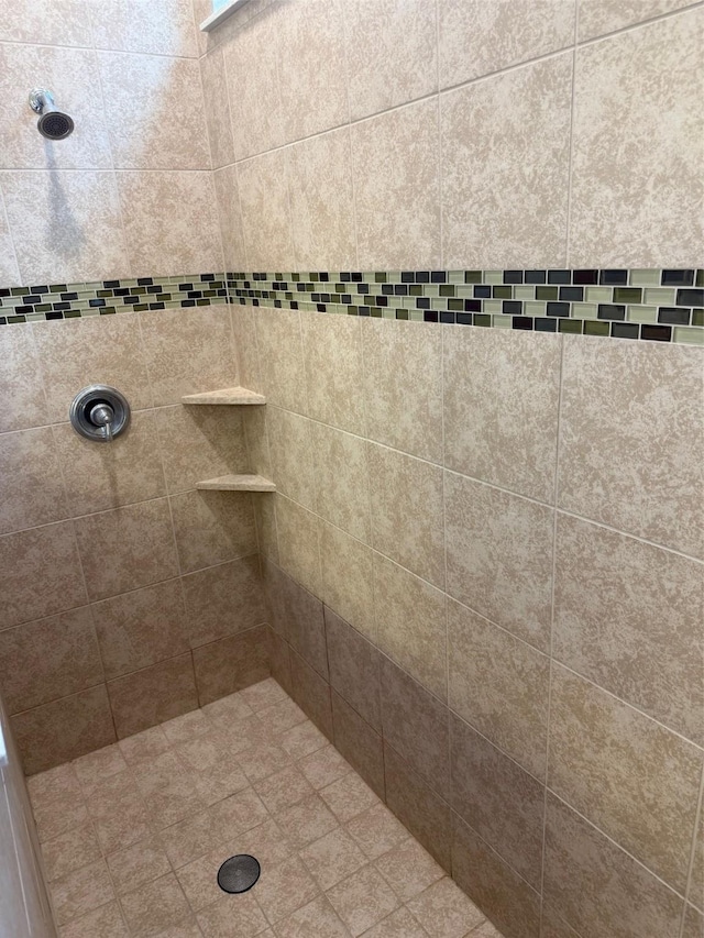 bathroom with tiled shower