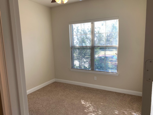 unfurnished room with baseboards, carpet floors, and ceiling fan