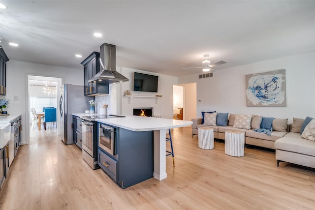 13660 Purple Sage Rd, Dallas, TX 75240 - kitchen with range hood, visible vents, appliances with stainless steel finishes, open floor plan, and a kitchen breakfast bar
