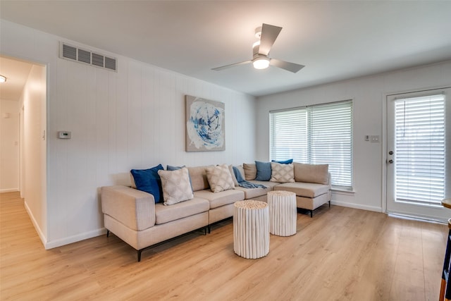 13660 Purple Sage Rd, Dallas, TX 75240 - living room with baseboards, light wood-style flooring, visible vents, and a ceiling fan