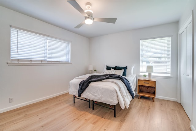 13660 Purple Sage Rd, Dallas, TX 75240 - bedroom with light wood-style floors, baseboards, and a closet