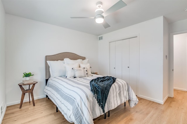 13660 Purple Sage Rd, Dallas, TX 75240 - bedroom featuring baseboards, visible vents, a ceiling fan, wood finished floors, and a closet