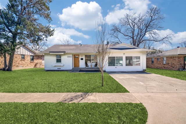 ranch-style house with brick siding and a front lawn