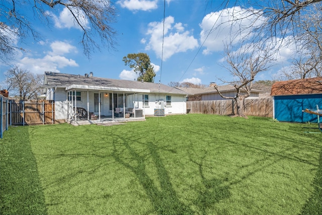 13660 Purple Sage Rd, Dallas, TX 75240 - back of house featuring a fenced backyard, a patio, an outdoor structure, and a lawn