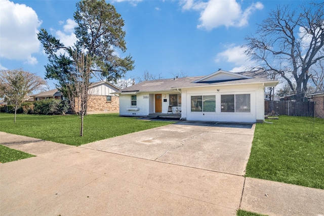 13660 Purple Sage Rd, Dallas, TX 75240 - ranch-style house with driveway, fence, a front yard, board and batten siding, and brick siding