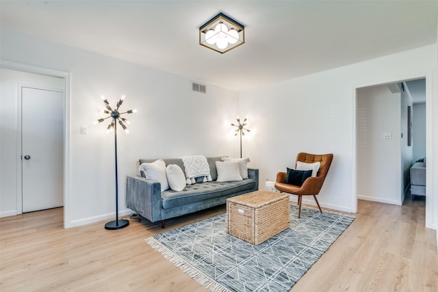 13660 Purple Sage Rd, Dallas, TX 75240 - living area featuring baseboards, visible vents, and wood finished floors
