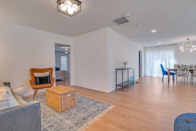 13660 Purple Sage Rd, Dallas, TX 75240 - living area with visible vents, baseboards, light wood-style flooring, a chandelier, and recessed lighting