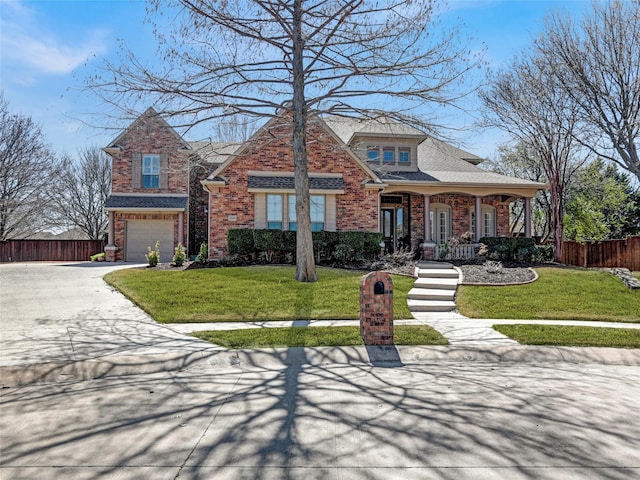 view of front of property with an attached garage, concrete driveway, a front lawn, and fence