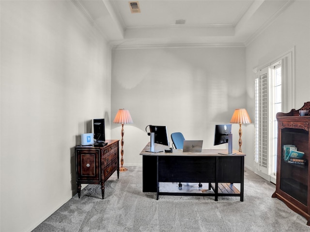 office area with visible vents, crown molding, a raised ceiling, and carpet floors