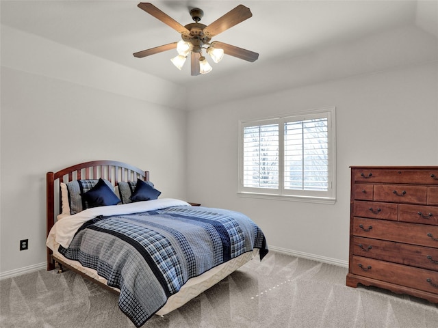 bedroom featuring a ceiling fan, baseboards, and carpet floors