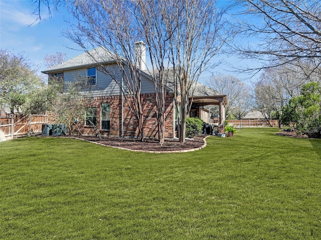 view of yard with a fenced backyard