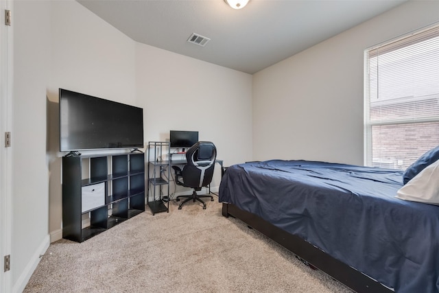 bedroom featuring carpet, visible vents, and baseboards