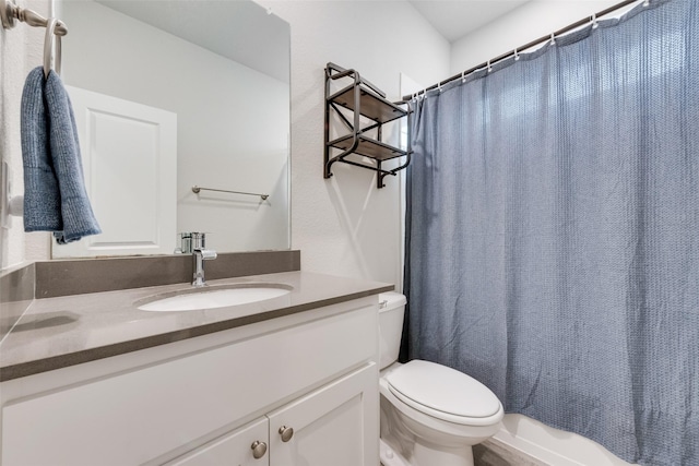 full bathroom featuring vanity and toilet