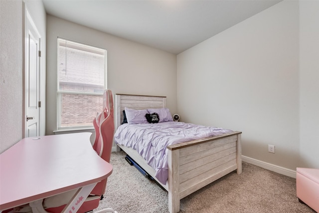 bedroom featuring baseboards and carpet flooring