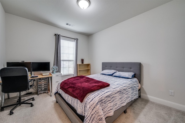 carpeted bedroom featuring wine cooler, visible vents, and baseboards