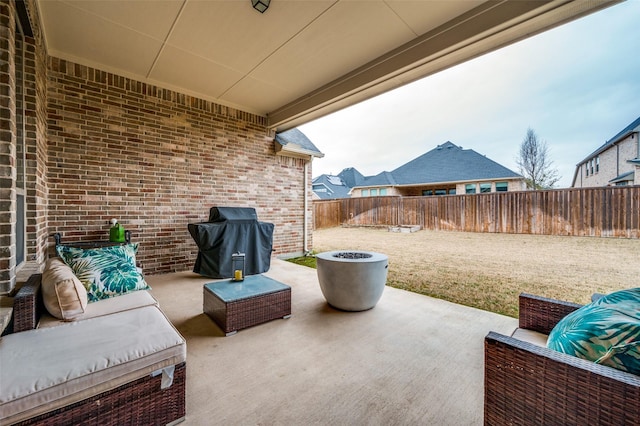 view of patio featuring a fenced backyard, a grill, and an outdoor living space