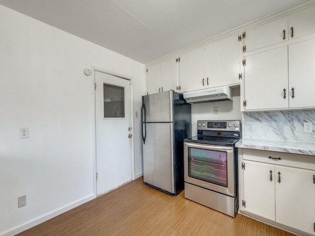 kitchen with light countertops, appliances with stainless steel finishes, white cabinetry, light wood-type flooring, and under cabinet range hood