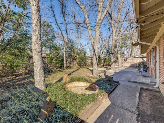 view of yard featuring a fenced backyard and a patio