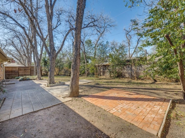 view of yard with a patio area and fence