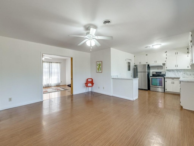 unfurnished living room with visible vents, baseboards, a ceiling fan, and light wood-style floors