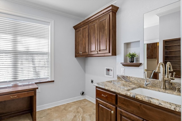 washroom featuring hookup for a washing machine, a sink, cabinet space, electric dryer hookup, and crown molding