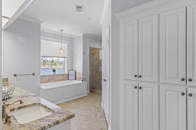 full bathroom featuring a garden tub, vanity, visible vents, ornamental molding, and a stall shower