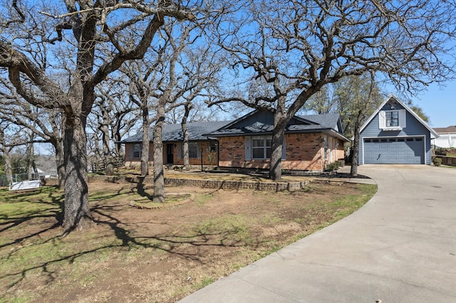 view of front of house with a garage and brick siding