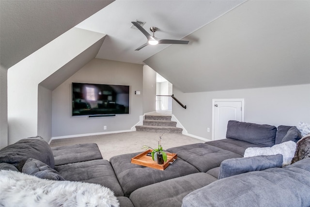 living room featuring ceiling fan, carpet flooring, baseboards, stairs, and vaulted ceiling