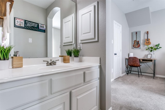 bathroom with baseboards and vanity