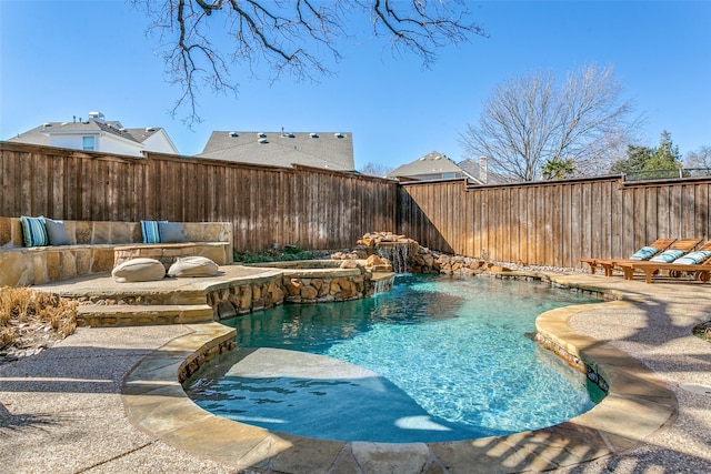 view of swimming pool featuring a fenced in pool, a patio area, and a fenced backyard